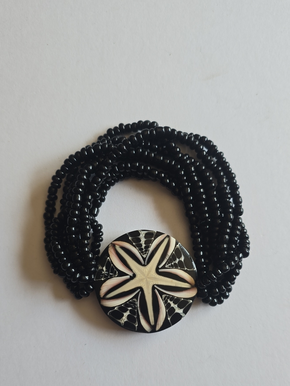 Black Beaded Multi-Strand Bracelet with Floral Button Accent